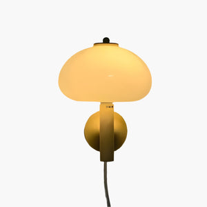 Wall-mounted lamp with a round base and dome-shaped shade.