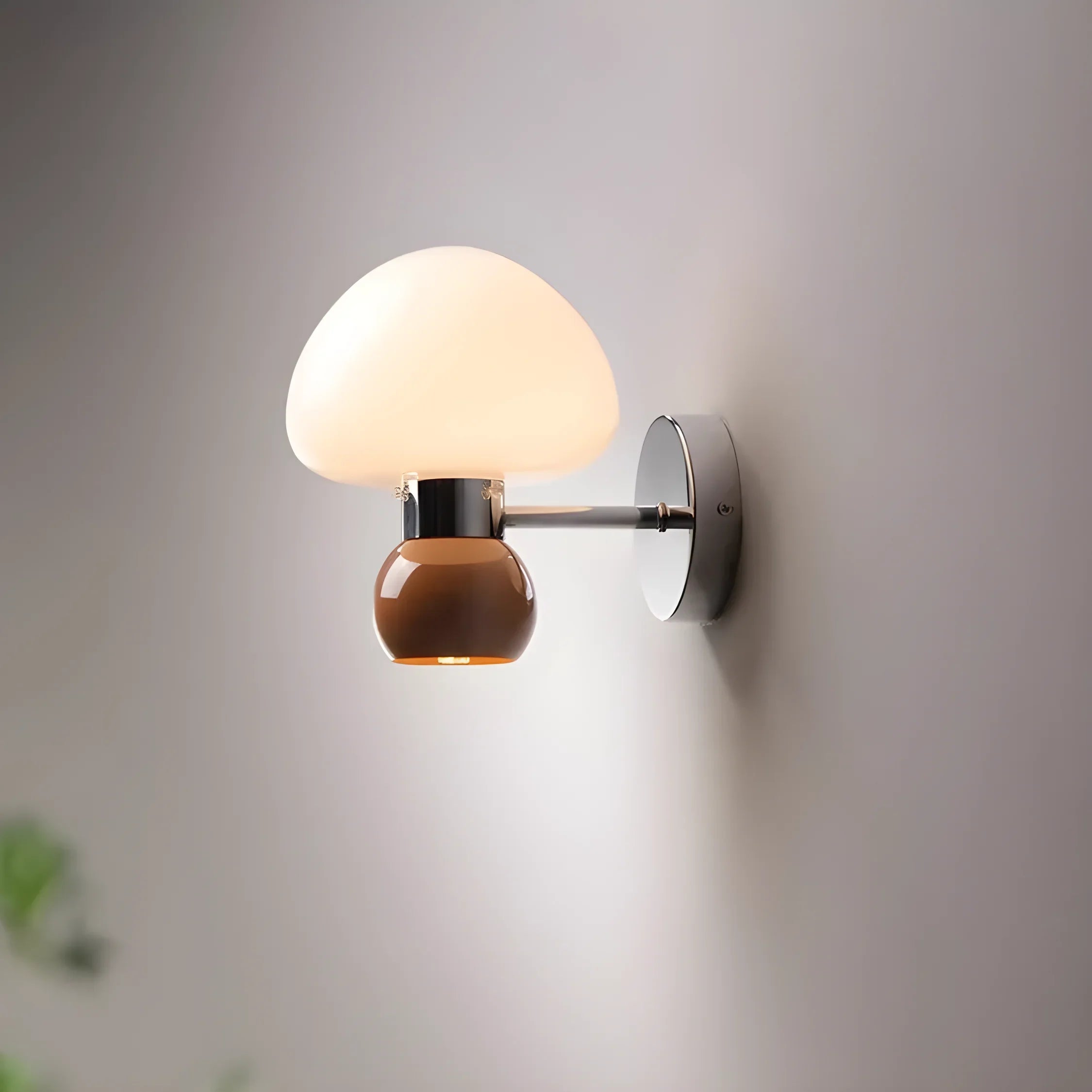 Wall-mounted lamp with a round white shade and wooden base.