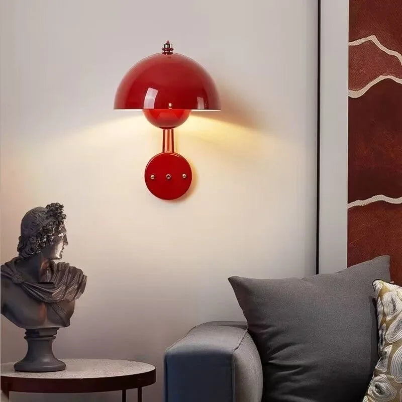 Red dome-shaped wall sconce with a spherical base.