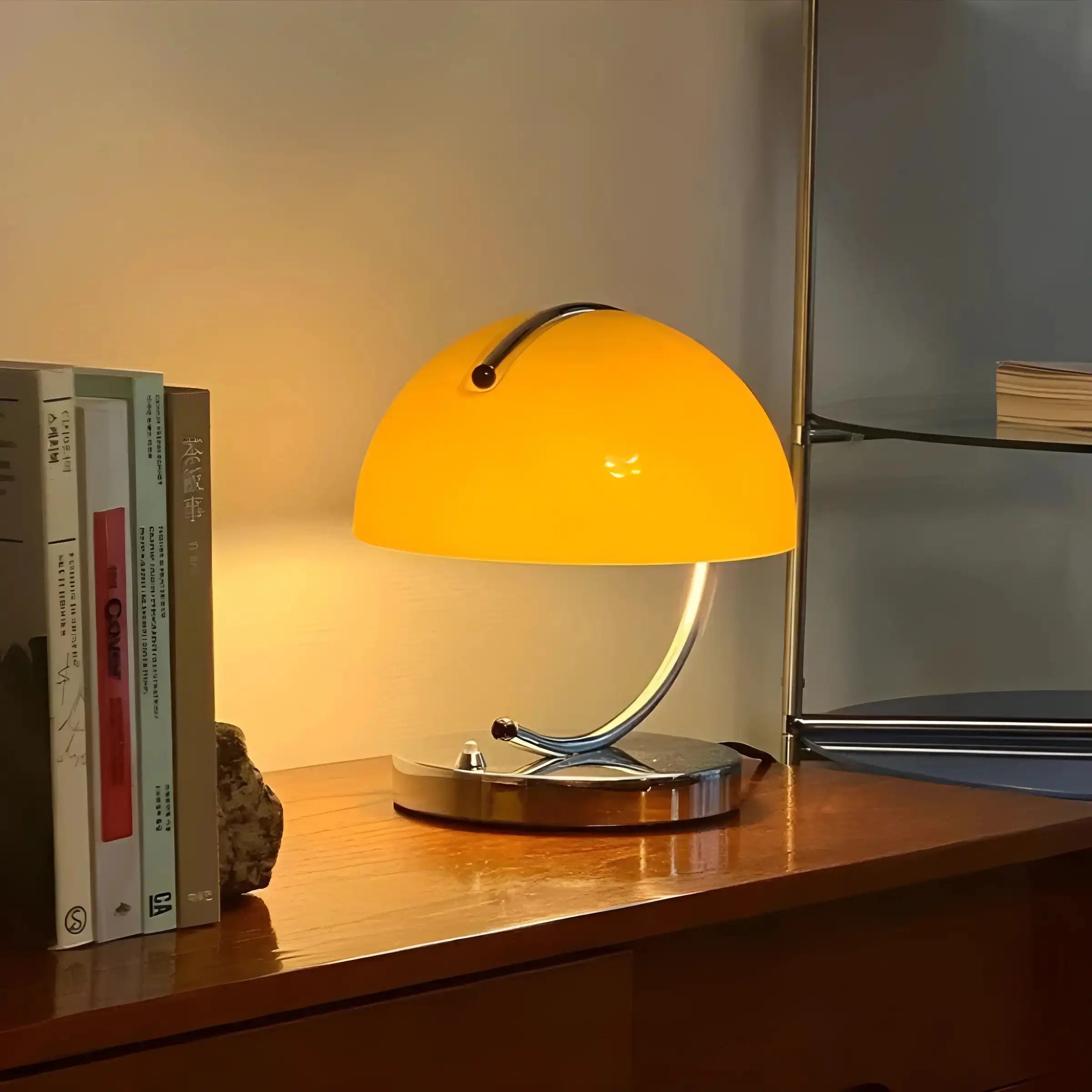 Retro-style desk lamp with a curved chrome base and yellow dome shade.