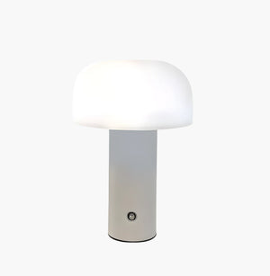 Modern table lamp with a white mushroom-shaped shade and cylindrical base.