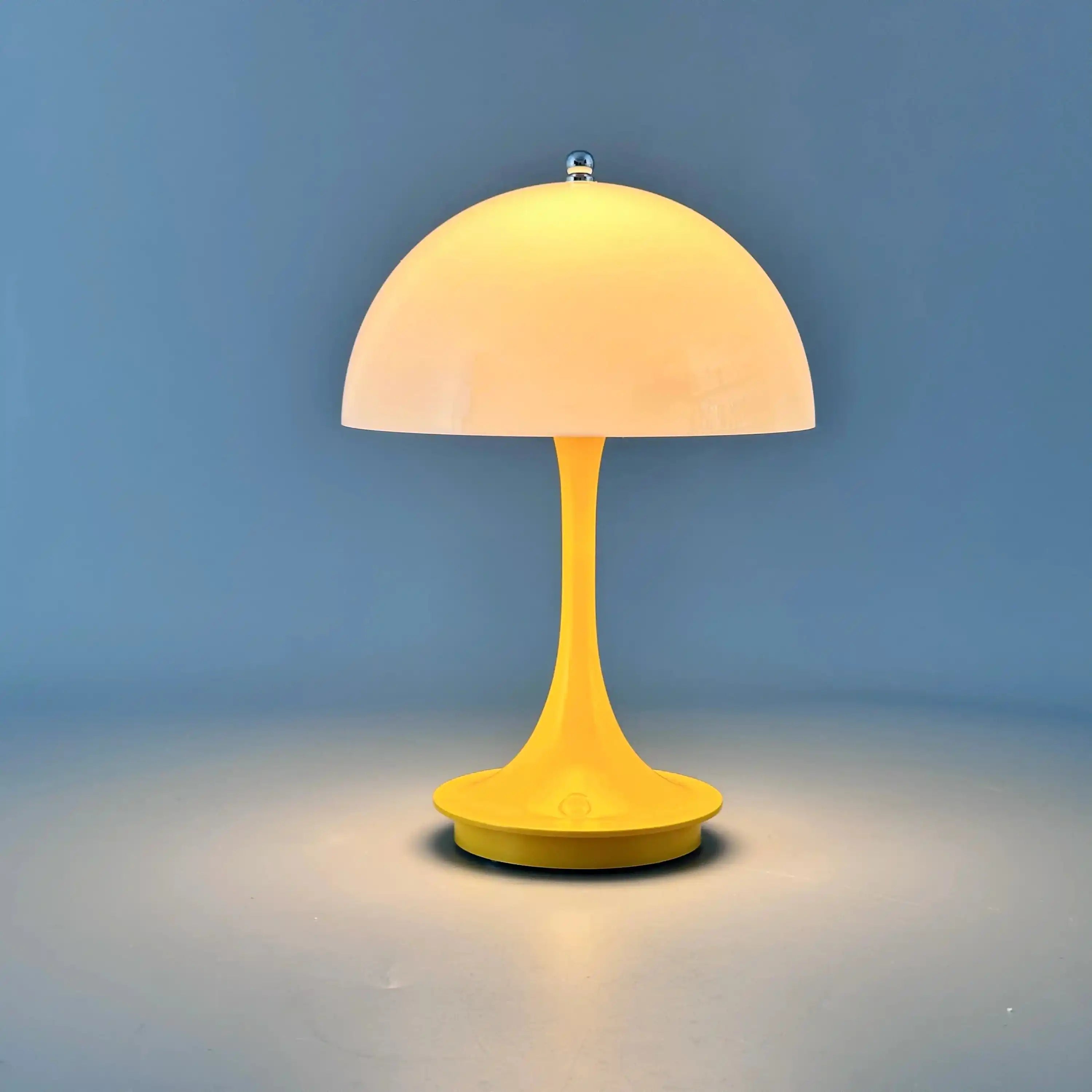 Yellow mushroom-shaped table lamp with a dome-like shade.